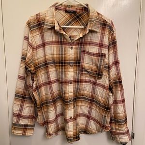 Flannel with one pocket, warm colors of orange and mustard.